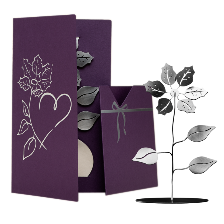 Little flower within a purple greeting card with insert